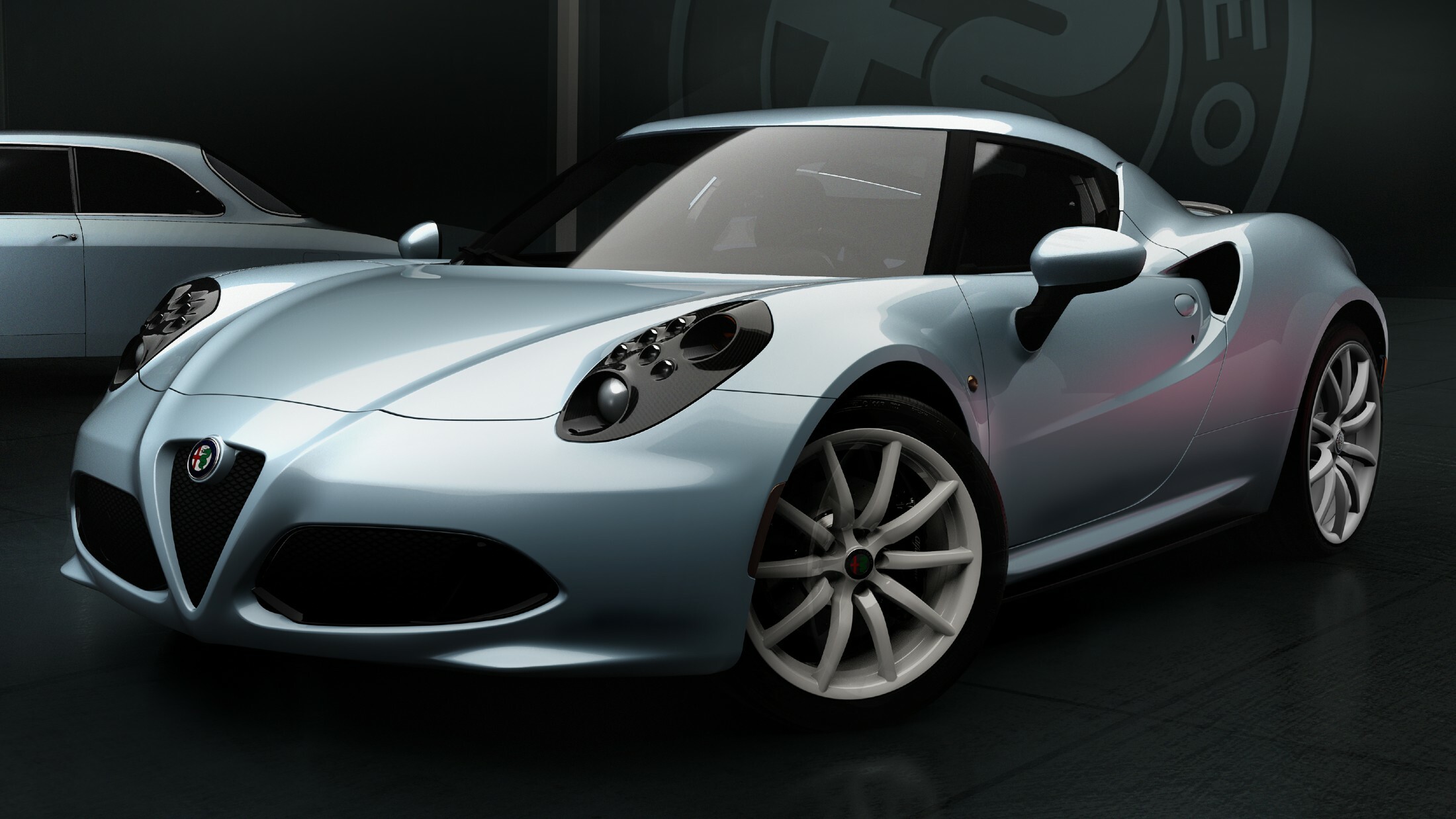 Alfa Romeo 4C driving on a winding road demonstrating agile handling and performance